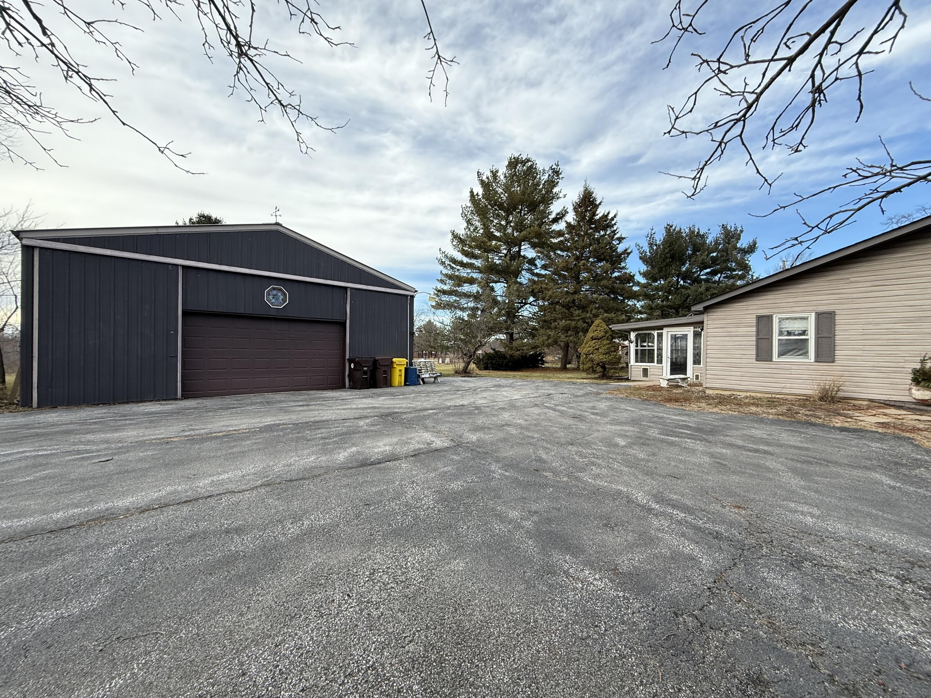 368 South 600th Street West Hebron, IN 46341 - Photo 5 of 87 a front view of house with a yard and garage