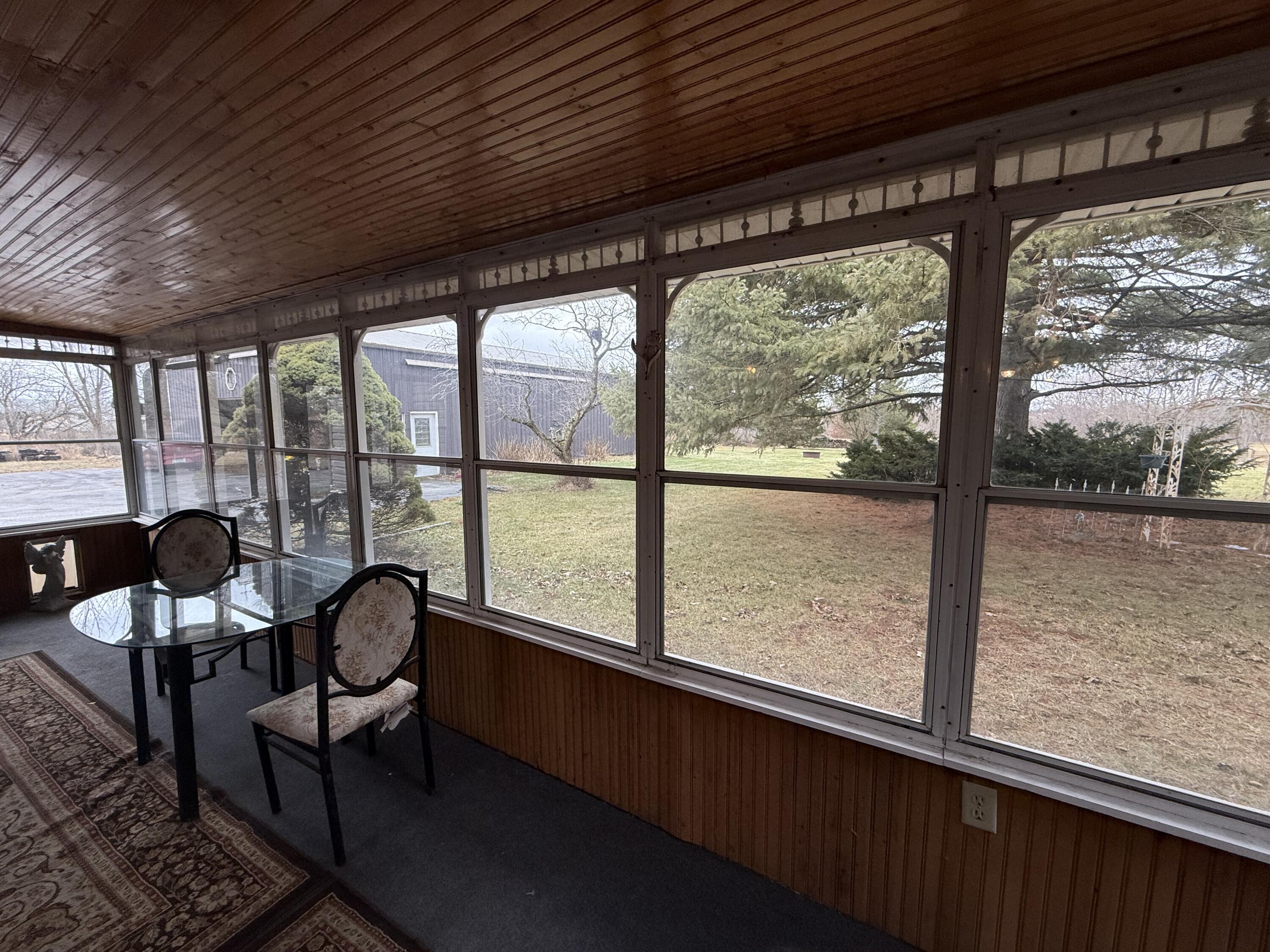 368 South 600th Street West Hebron, IN 46341 - Photo 69 of 87 a view of a living room with furniture and a floor to ceiling window