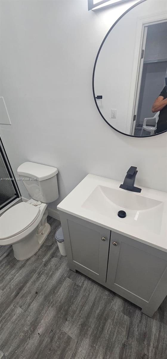 15647 Southwest 113th Place Miami, FL 33157 - Photo 1 of 6 a bathroom with a sink and a mirror