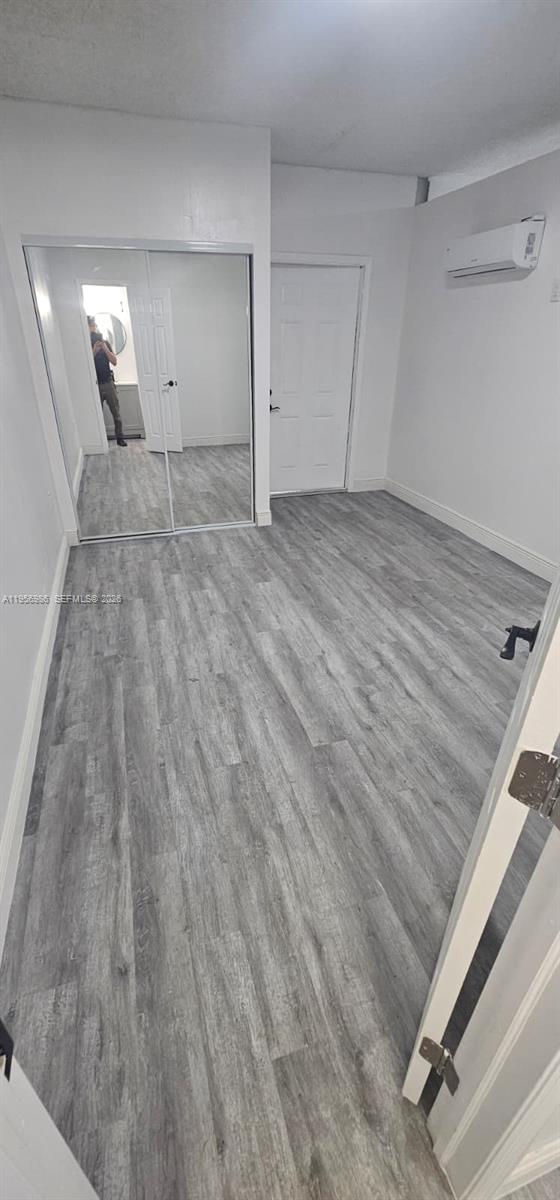 15647 Southwest 113th Place Miami, FL 33157 - Photo 6 of 6 a view of a room with wooden floor
