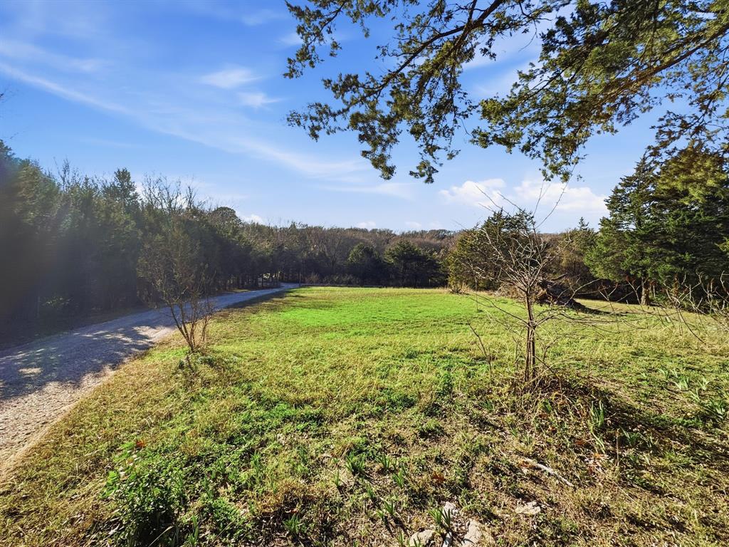 266 Bennett Road Ennis, TX 75119 - Photo 2 of 6 a view of a yard with an outdoor space