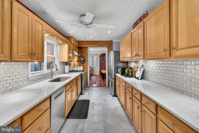 a front view of a house with a yard and outdoor seating