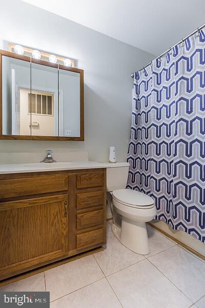3450 Allday Road Huntingtown, MD 20639 - Photo 16 of 23 a bathroom with a toilet sink and mirror