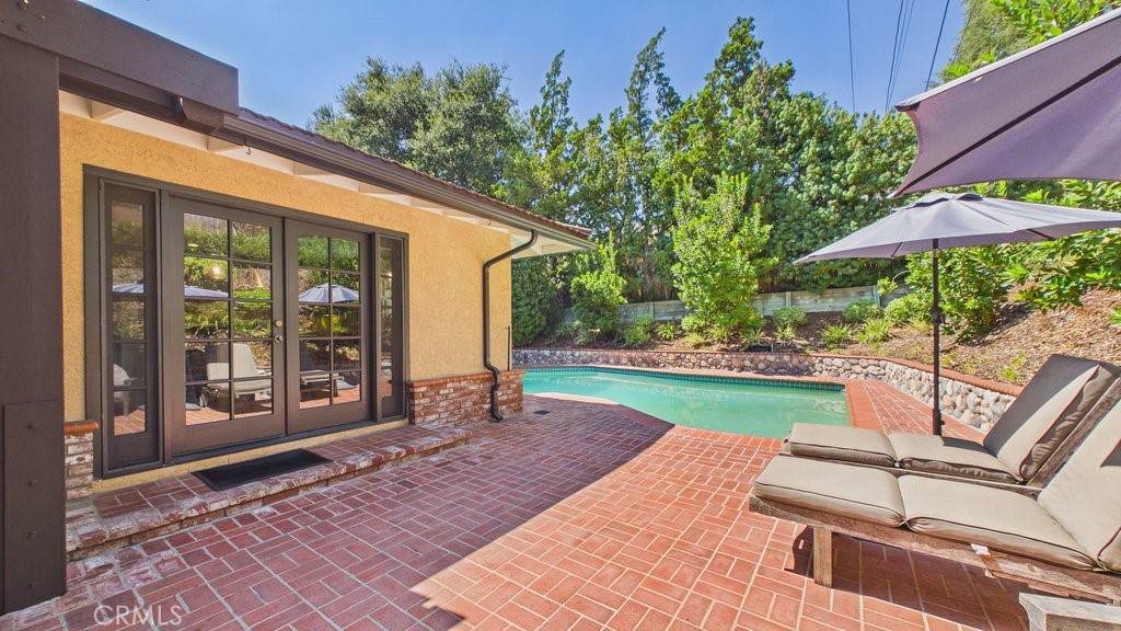 340 Toyon Road Sierra Madre, CA 91024 - Photo 48 of 60 Spacious patio and pool area featuring French doors that provide direct access to the kitchen.
