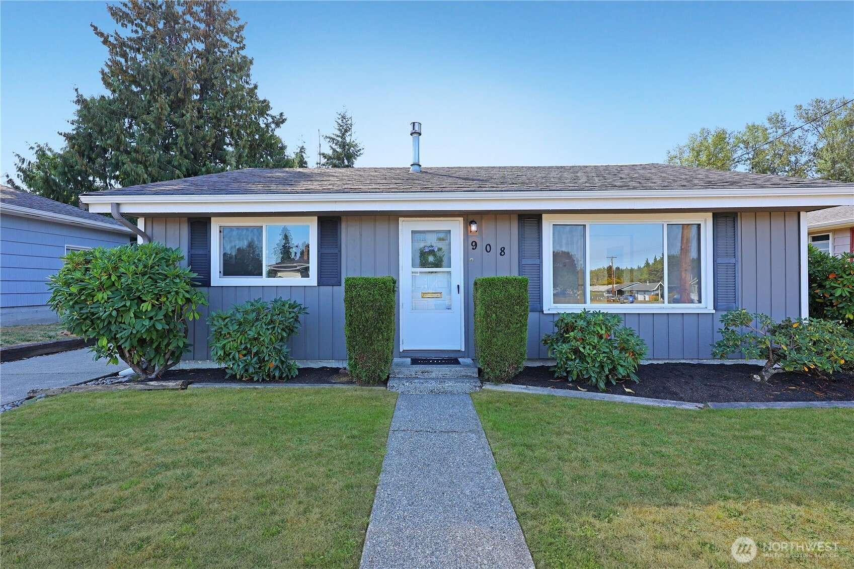 a front view of a house with garden