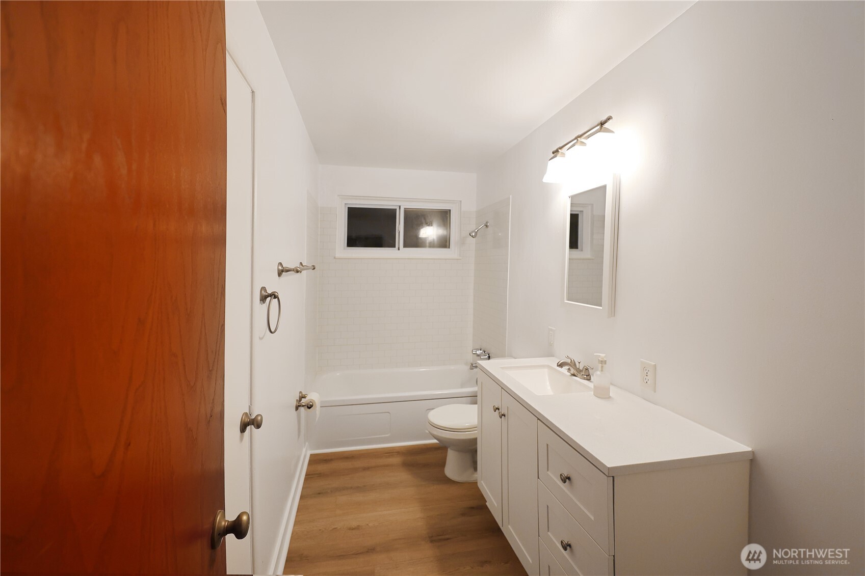 908 Willow Street Sumner, WA 98390 - Photo 12 of 32 a bathroom with a double vanity sink a toilet and shower