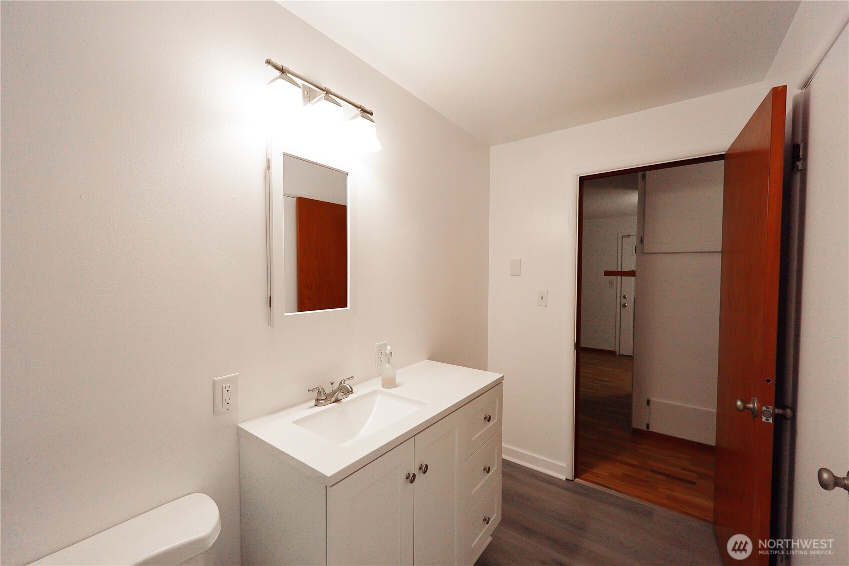 908 Willow Street Sumner, WA 98390 - Photo 13 of 32 a bathroom with a sink toilet and vanity