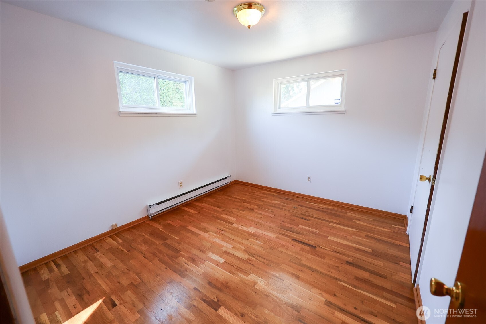 908 Willow Street Sumner, WA 98390 - Photo 16 of 32 an empty room with a window