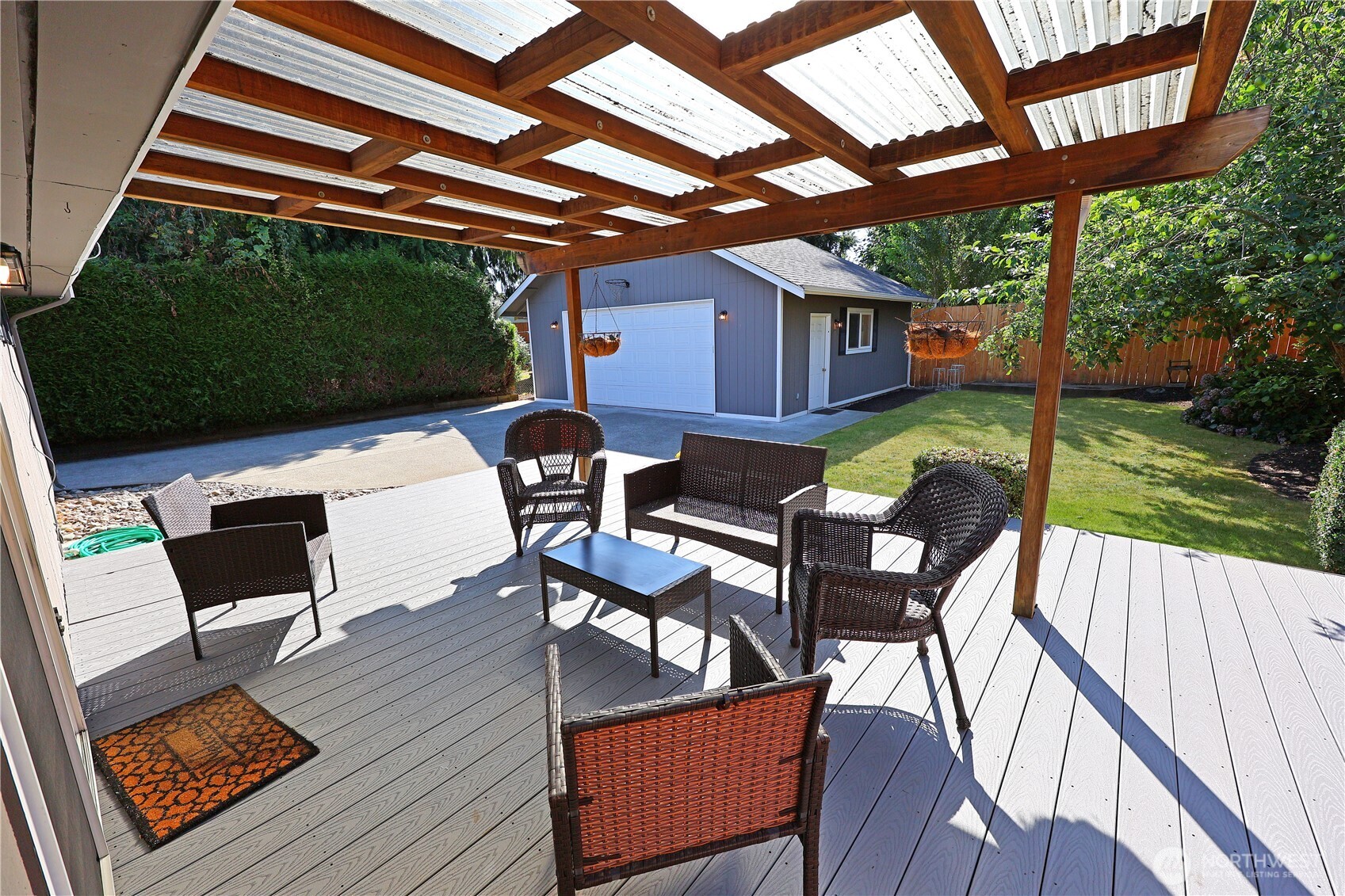 908 Willow Street Sumner, WA 98390 - Photo 19 of 32 a view of a chairs and table in patio with a backyard