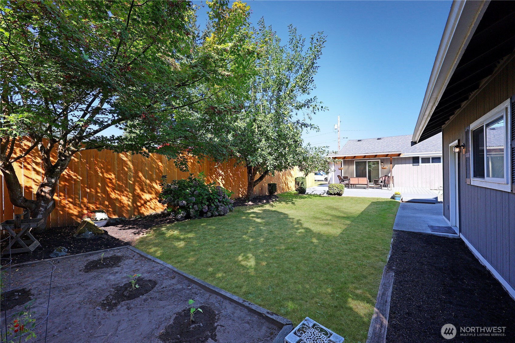908 Willow Street Sumner, WA 98390 - Photo 25 of 32 a view of a house with a yard