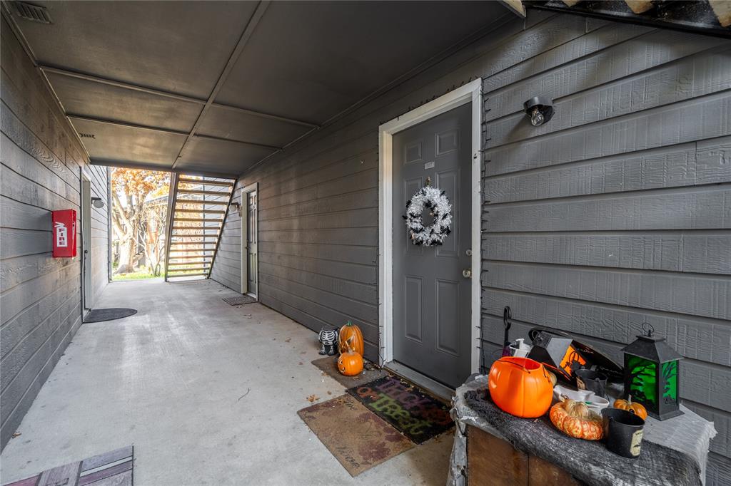 18333 Roehampton Drive, Unit 1117 Dallas, TX 75252 - Photo 2 of 14 a backyard of a house with seating space
