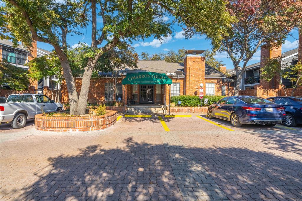 18333 Roehampton Drive, Unit 1117 Dallas, TX 75252 - Photo 8 of 14 a view of a street with a cars park