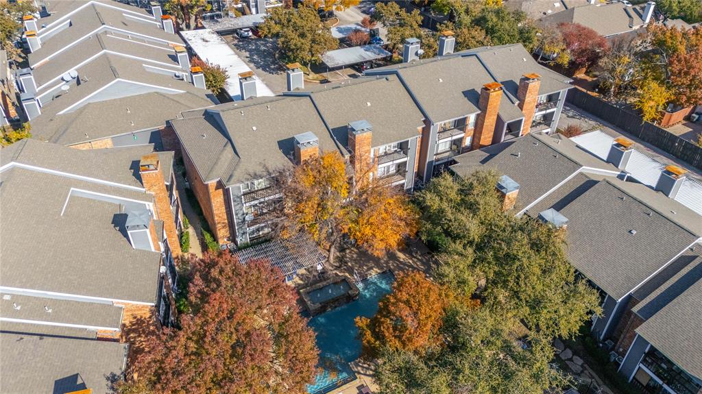 18333 Roehampton Drive, Unit 1117 Dallas, TX 75252 - Photo 9 of 14 an aerial view of residential houses with outdoor space