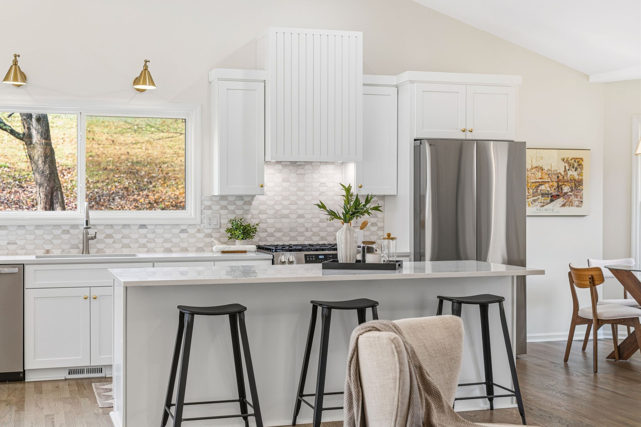 209 Pin Oak Court Spring Hill, TN 37174 - Photo 17 of 53 a kitchen with stainless steel appliances granite countertop white cabinets a sink and a large window