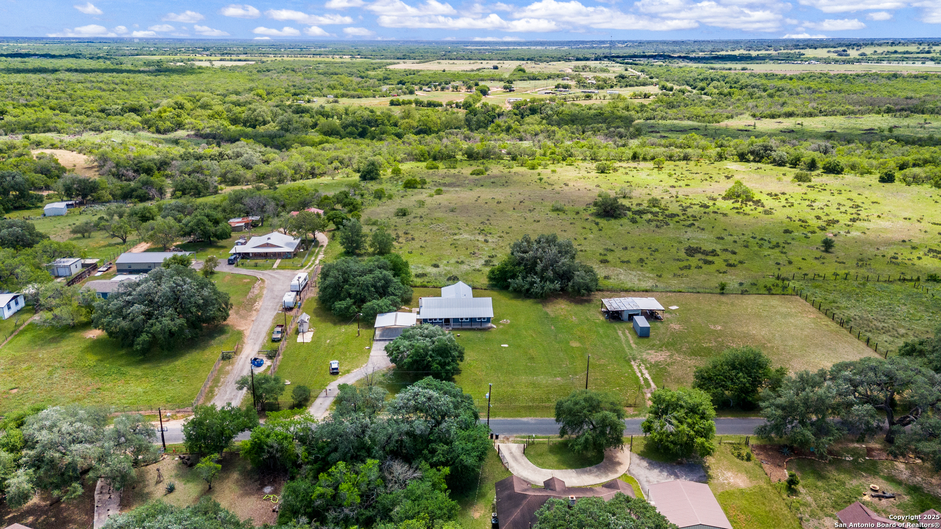 18950 Southton Road Elmendorf, TX 78112 - Photo 14 of 16 an aerial view of residential houses with outdoor space and city view