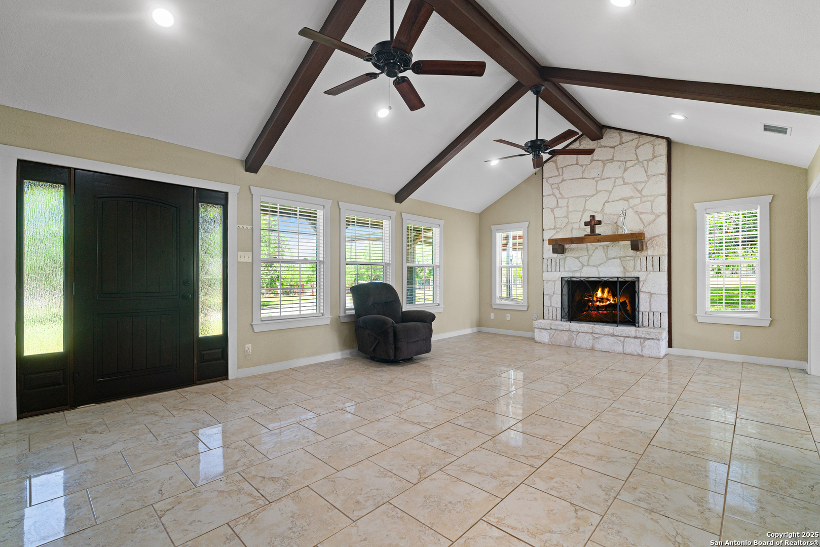 18950 Southton Road Elmendorf, TX 78112 - Photo 3 of 16 a living room with furniture and a fireplace