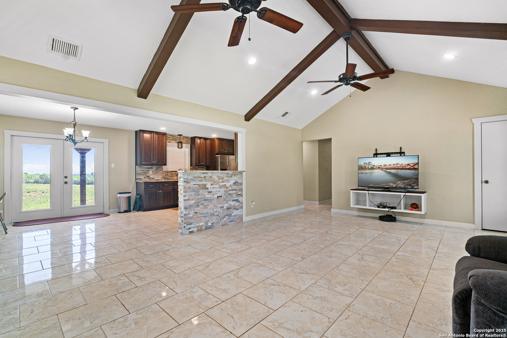 18950 Southton Road Elmendorf, TX 78112 - Photo 4 of 16 a room with gym equipment and a view of living room