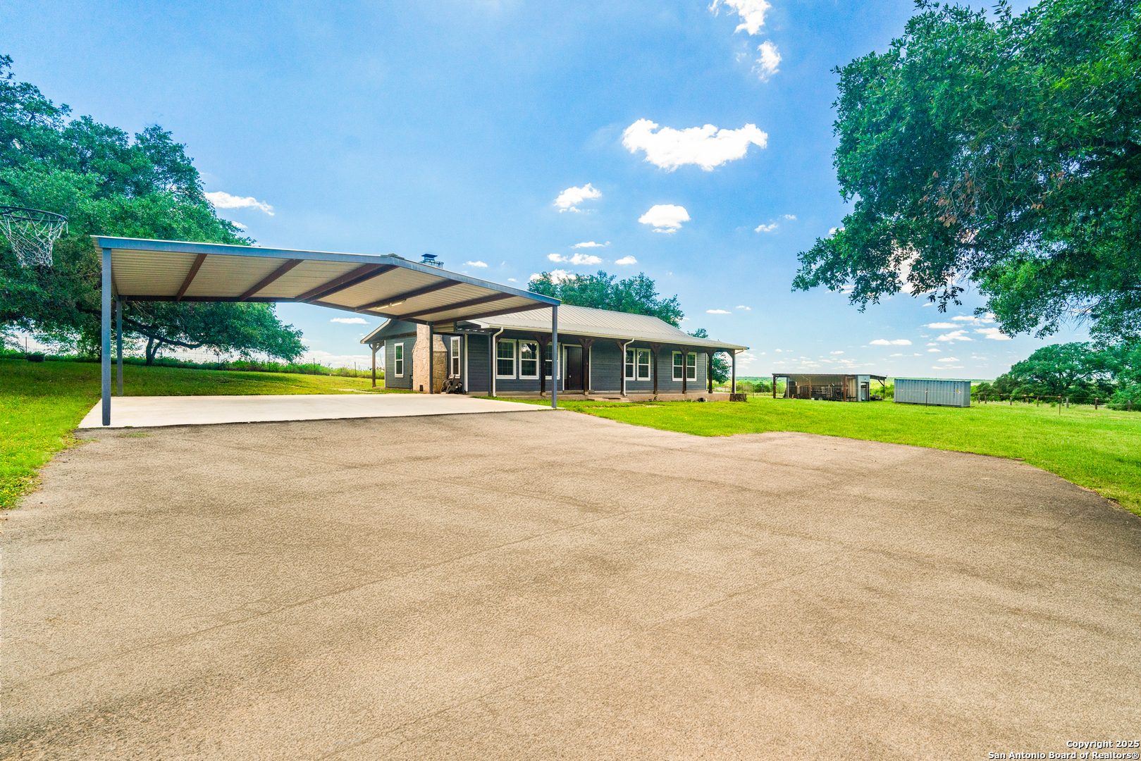 18950 Southton Road Elmendorf, TX 78112 - Photo 8 of 16 a view of house with outdoor space and swimming pool