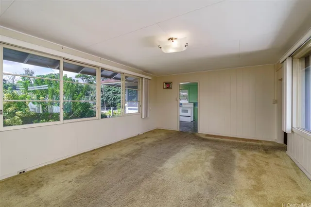 a view of an empty room with windows