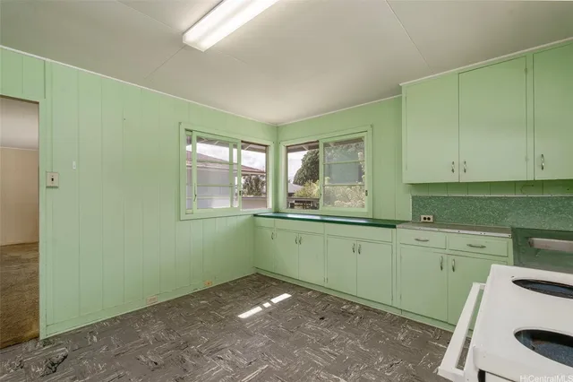 a room with washing machine and window