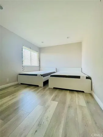 a view of room with wooden floor and window