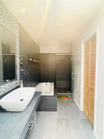 a bathroom with a tub and a sink
