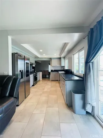 a large open kitchen with a large window
