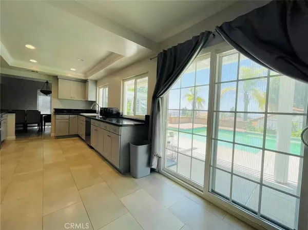 a kitchen with stainless steel appliances granite countertop a stove and a sink