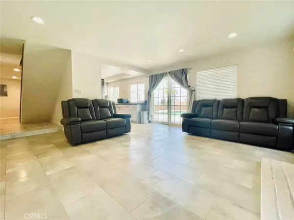 a living room with furniture window and flowerpot