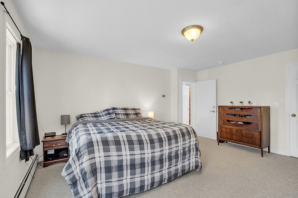 365 State Road Phillipston, MA 01331 - Photo 15 of 25 a bedroom with a bed and a lamp on dresser