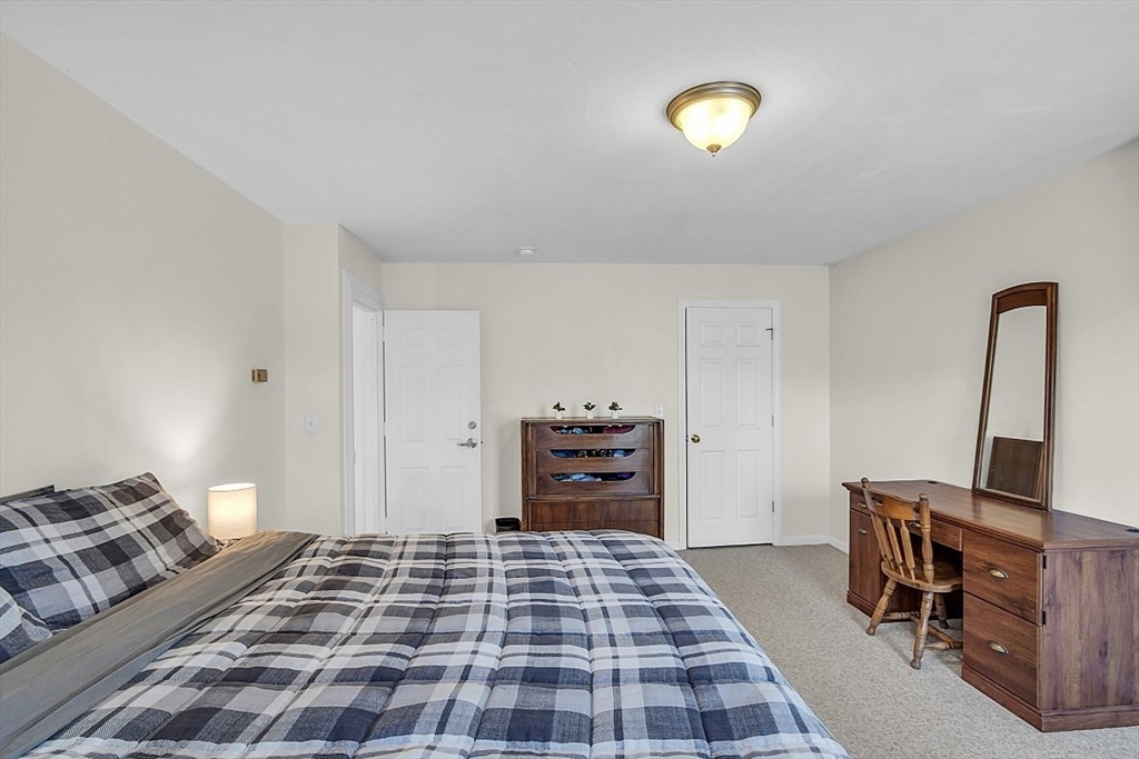365 State Road Phillipston, MA 01331 - Photo 16 of 25 a bedroom with a bed and a lamp on the dresser