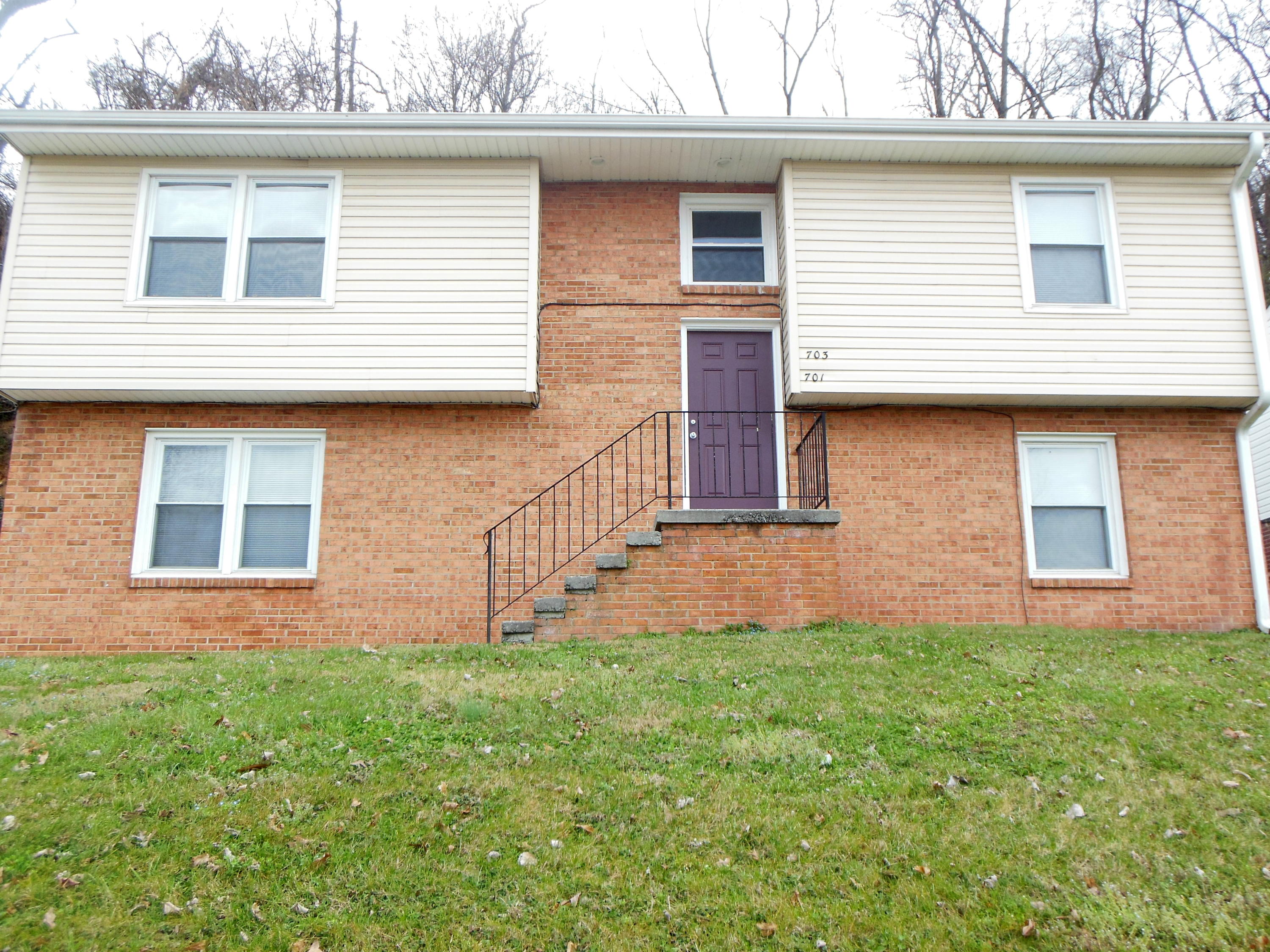 a brick house with a large windows