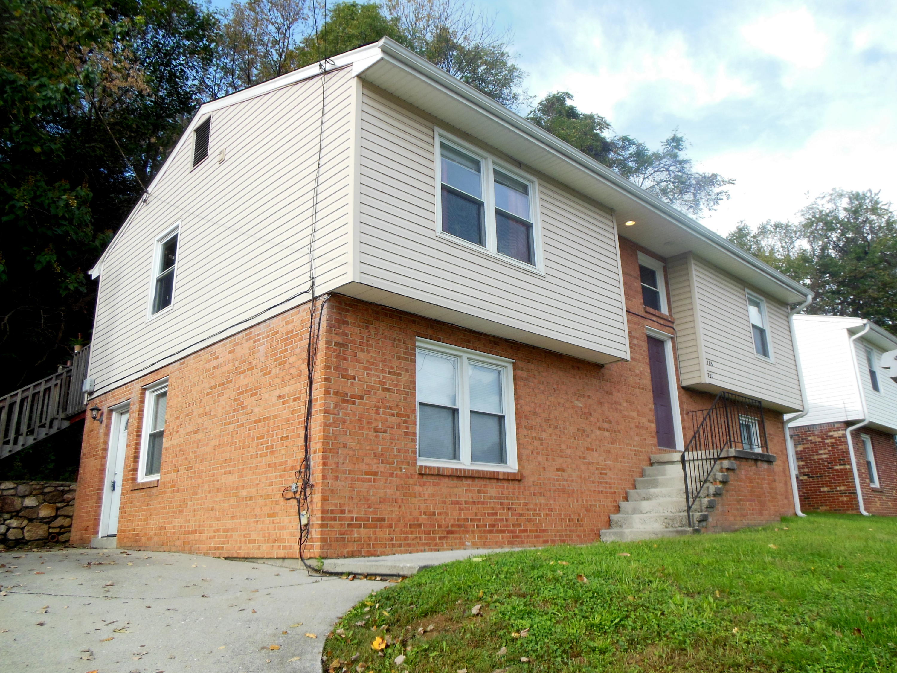 701 Riverland Road Southeast Roanoke, VA 24014 - Photo 2 of 33 a view of a house with a yard