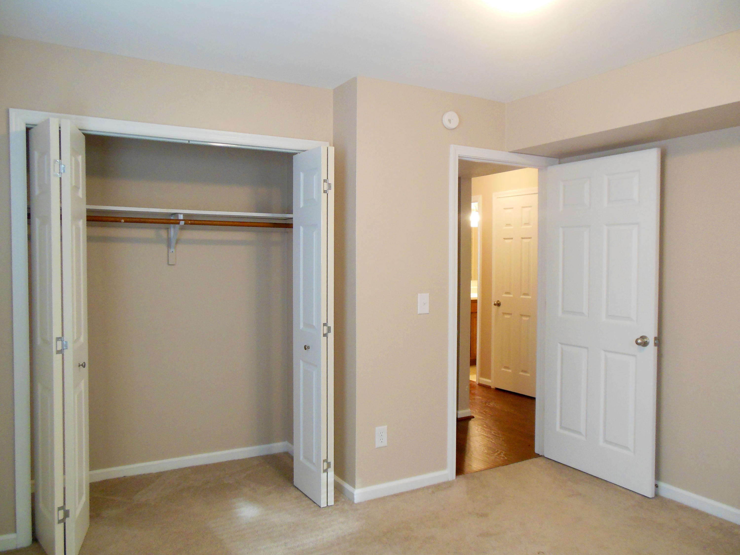 701 Riverland Road Southeast Roanoke, VA 24014 - Photo 18 of 33 a view of an empty room with closet and wooden floor