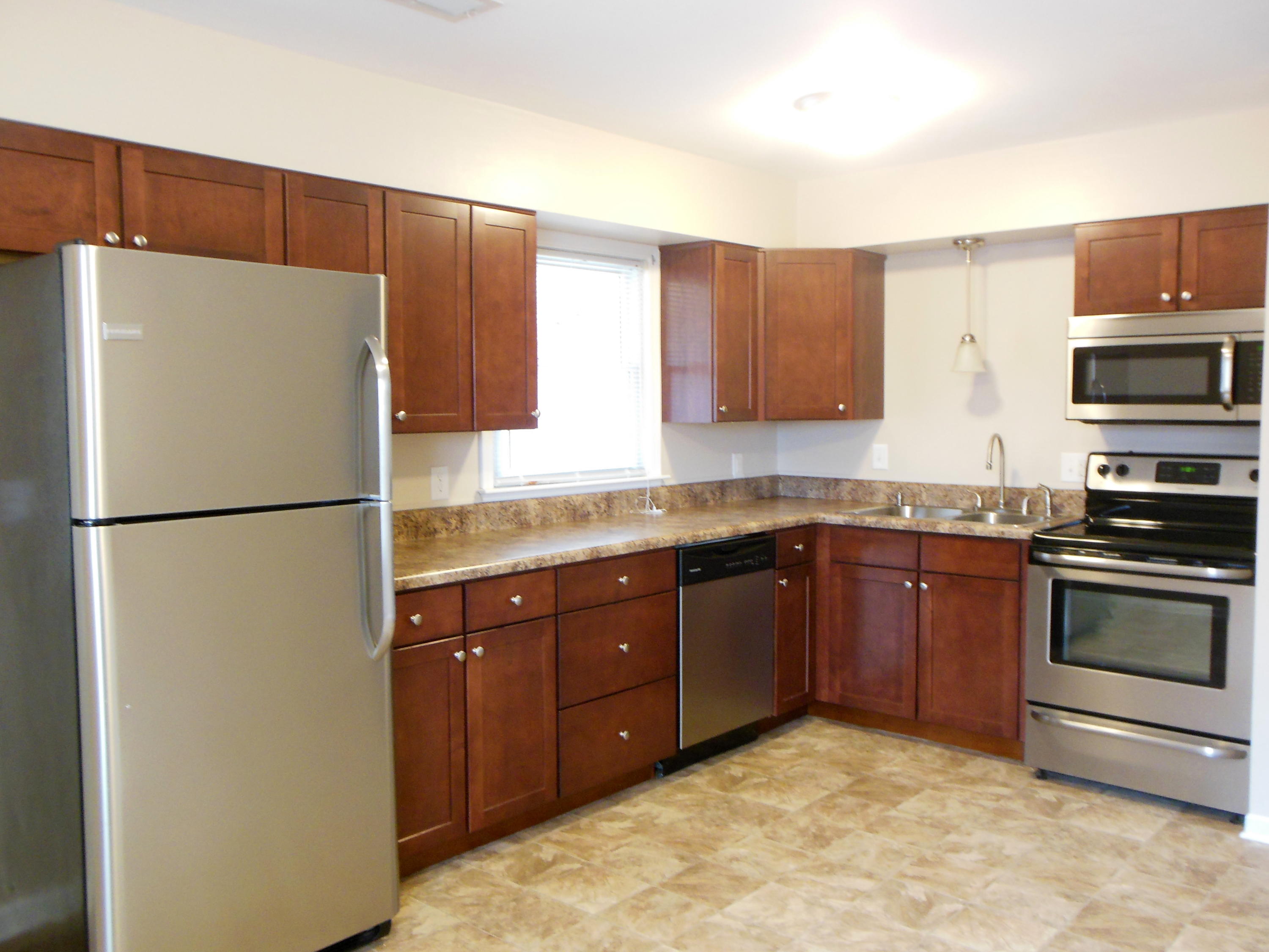 701 Riverland Road Southeast Roanoke, VA 24014 - Photo 20 of 33 a kitchen with stainless steel appliances granite countertop a refrigerator stove a sink dishwasher and microwave