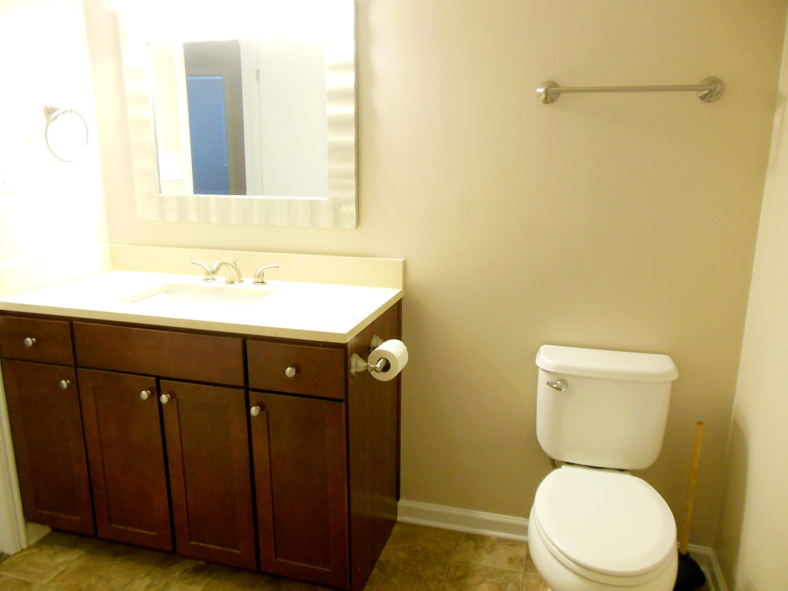 701 Riverland Road Southeast Roanoke, VA 24014 - Photo 23 of 33 a bathroom with a granite countertop toilet sink and mirror