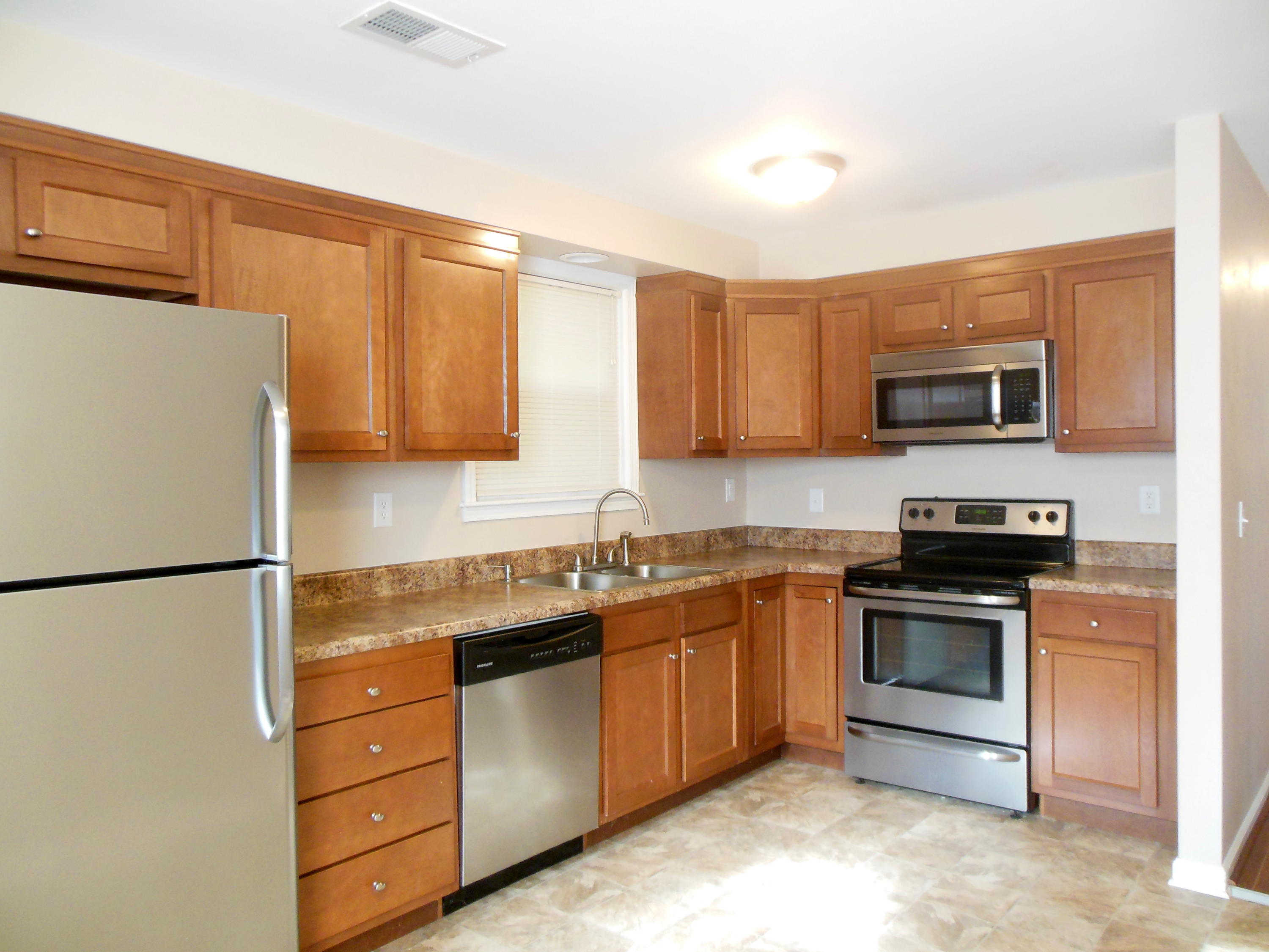 701 Riverland Road Southeast Roanoke, VA 24014 - Photo 4 of 33 a kitchen with stainless steel appliances granite countertop a refrigerator stove a sink and dishwasher