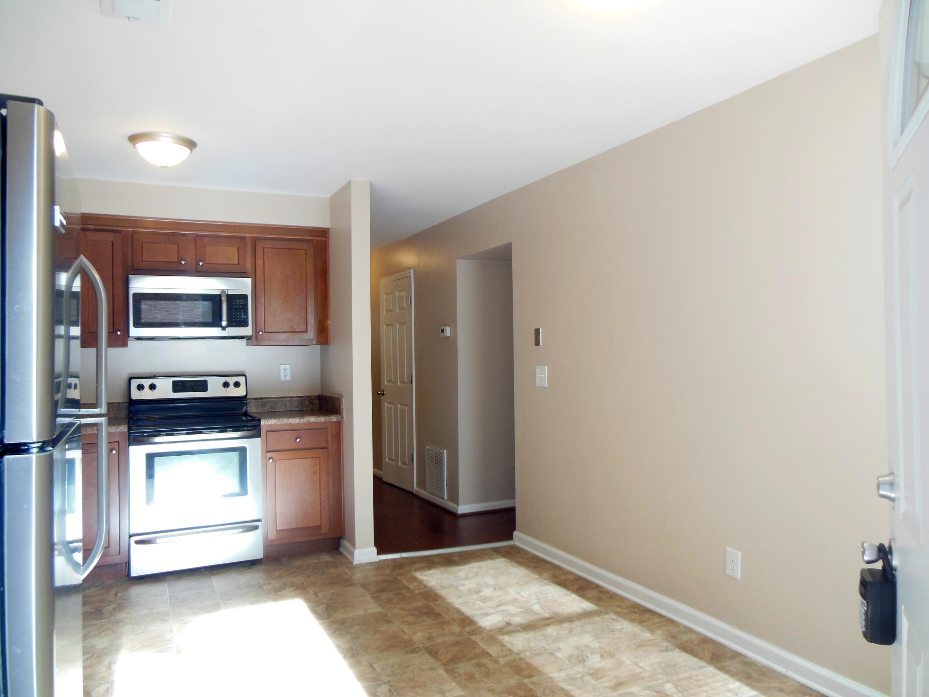 701 Riverland Road Southeast Roanoke, VA 24014 - Photo 5 of 33 a kitchen with stainless steel appliances granite countertop a refrigerator and a stove top oven