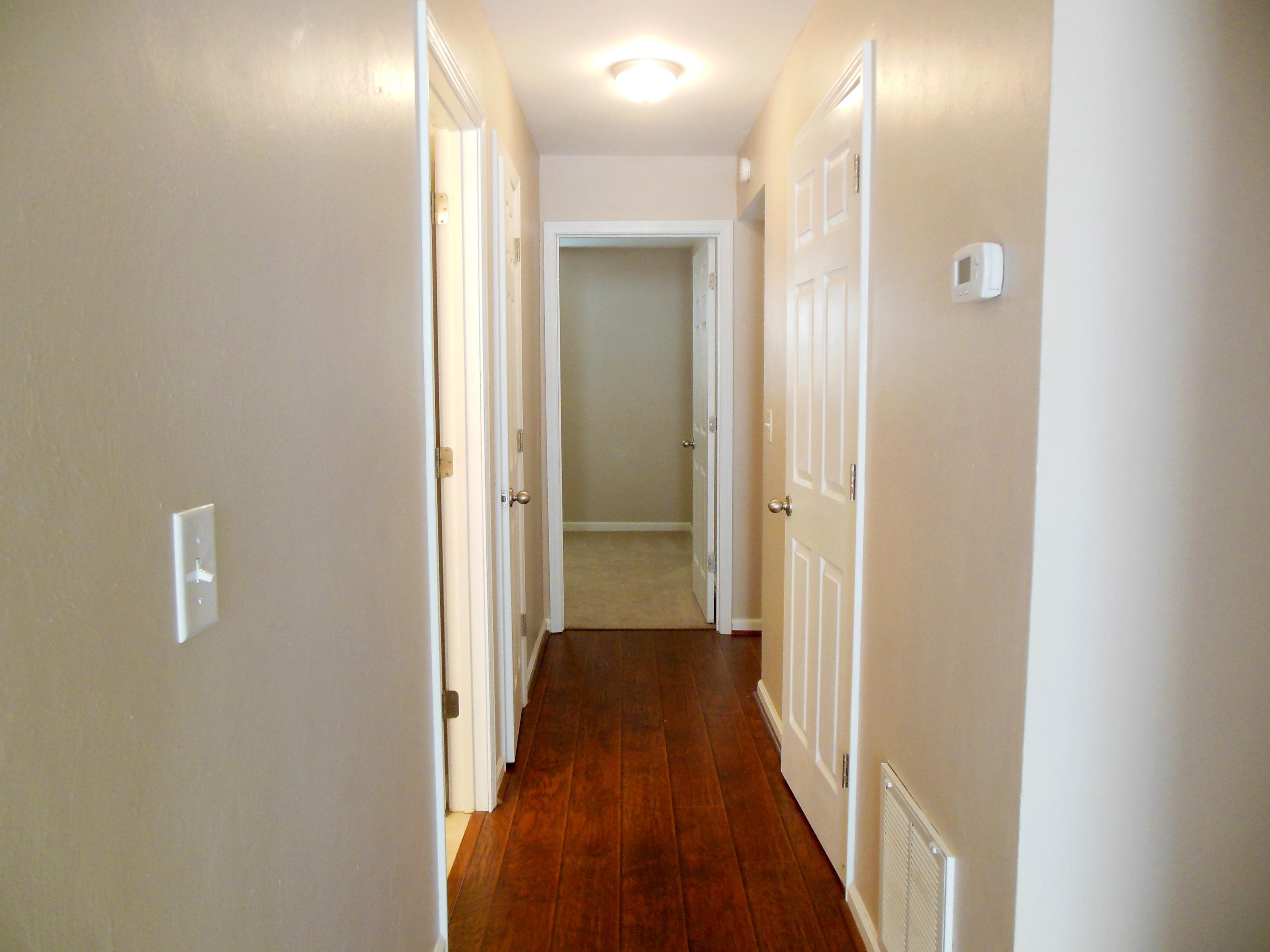 701 Riverland Road Southeast Roanoke, VA 24014 - Photo 9 of 33 a view of a hallway with a wooden floor