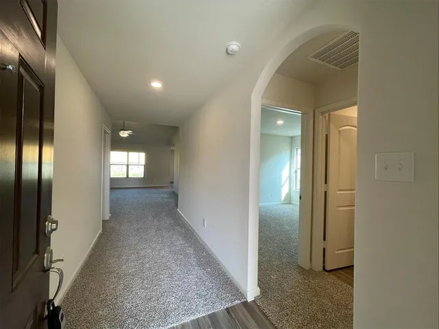 a view of hallway with livingroom