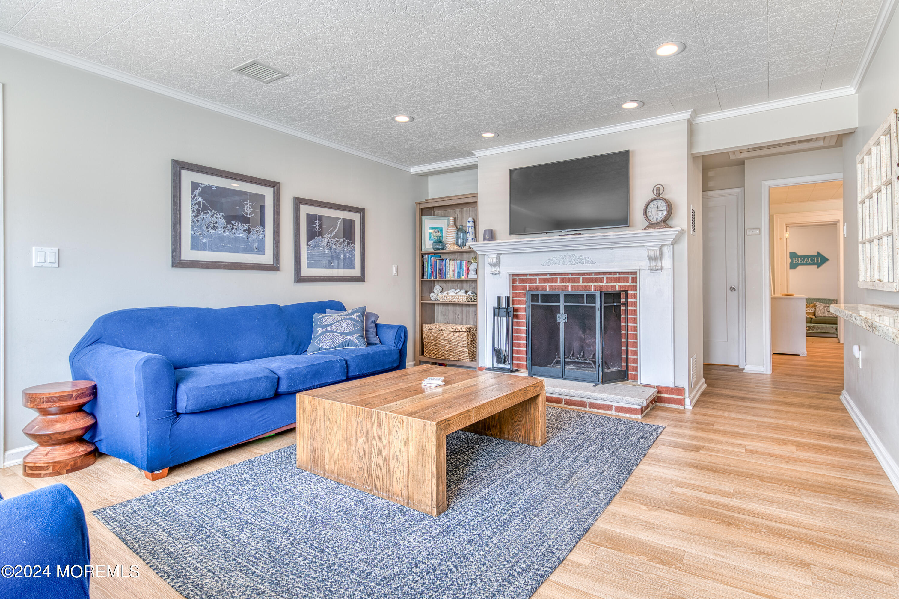 19 Via Ripa Way Sea Bright, NJ 07760 - Photo 12 of 41 a living room with furniture fireplace and flat screen tv