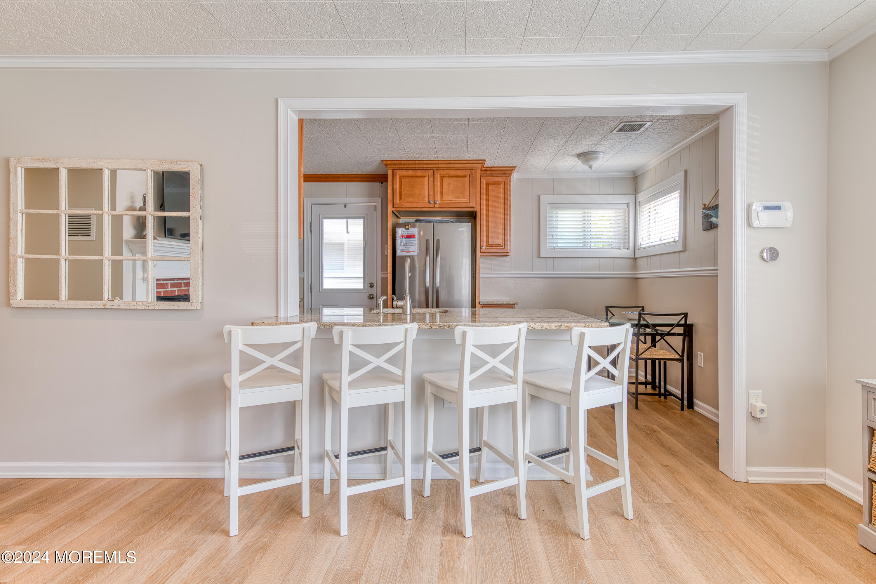 19 Via Ripa Way Sea Bright, NJ 07760 - Photo 14 of 41 a view of a dining room with furniture and wooden floor