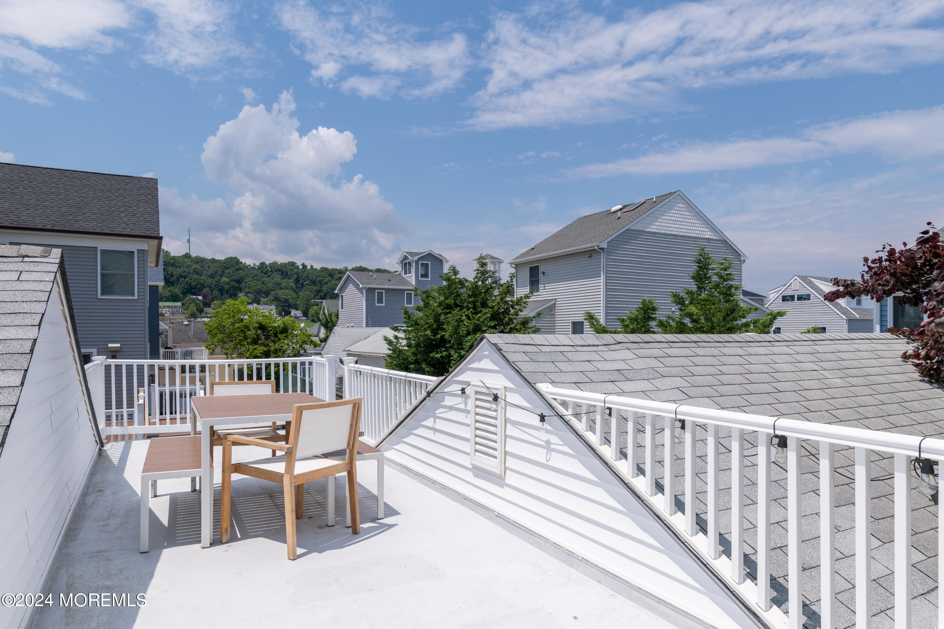 19 Via Ripa Way Sea Bright, NJ 07760 - Photo 38 of 41 a view of a chairs and table on the terrace