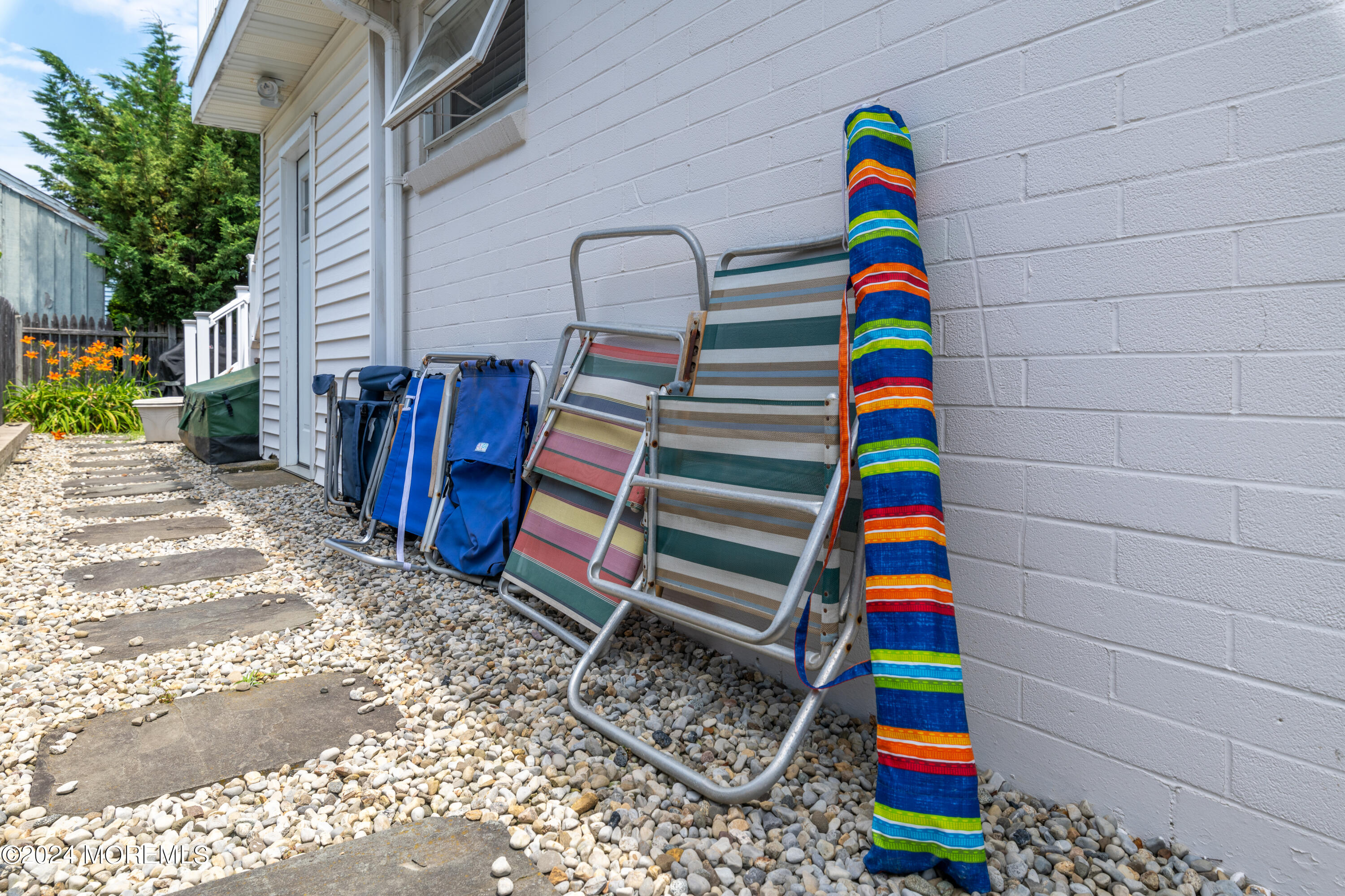 19 Via Ripa Way Sea Bright, NJ 07760 - Photo 41 of 41 a room with lots of baby toys and flat screen tv