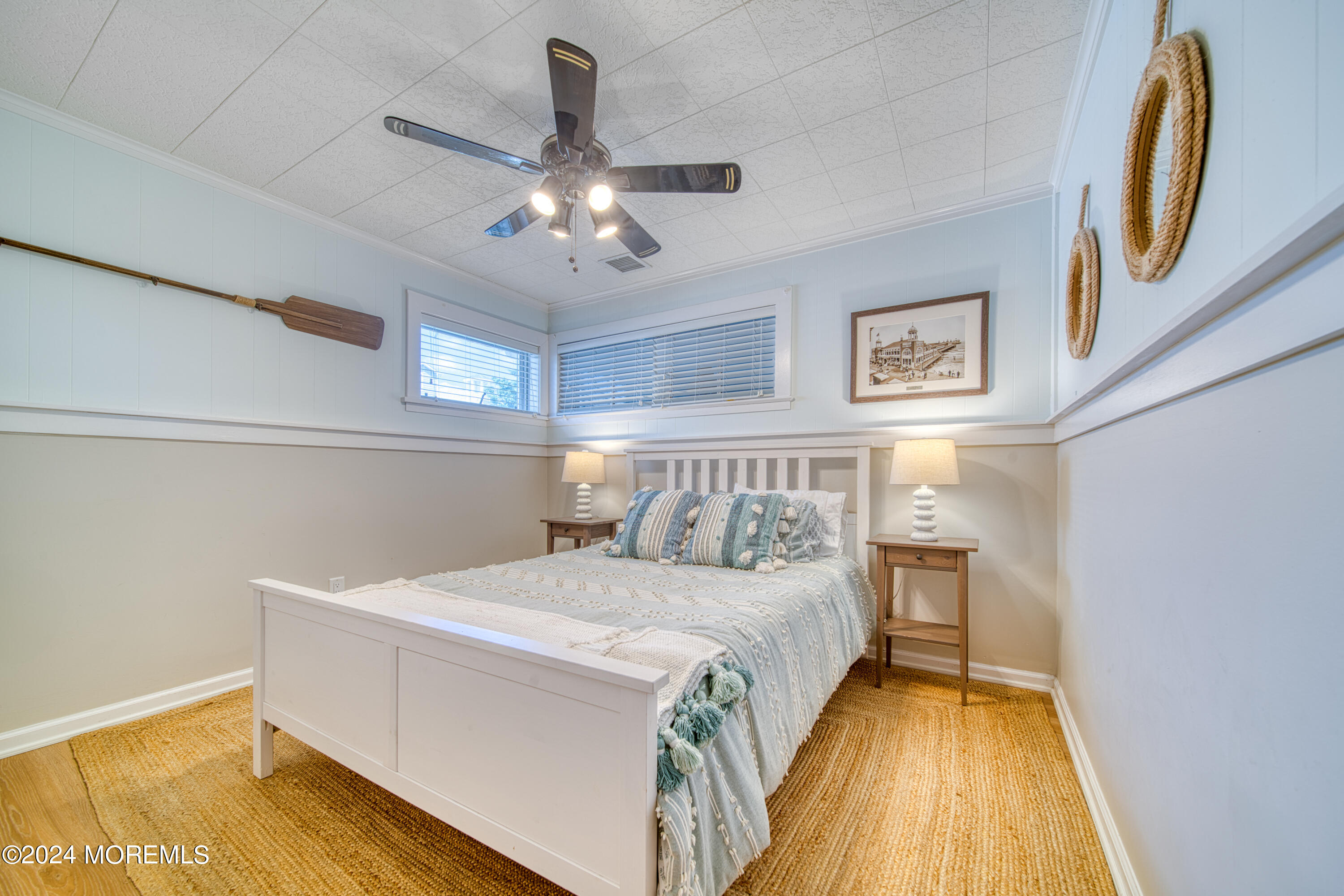 19 Via Ripa Way Sea Bright, NJ 07760 - Photo 7 of 41 a bedroom with a bed and a chandelier
