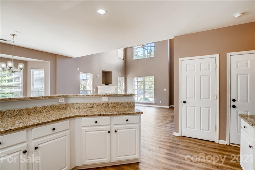 4912 Missi Lane Fort Mill, SC 29708 - Photo 12 of 33 a kitchen with granite countertop white cabinets and a granite counter tops