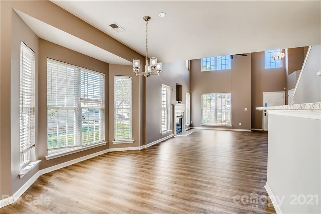 4912 Missi Lane Fort Mill, SC 29708 - Photo 15 of 33 a view of an empty room with window and wooden floor