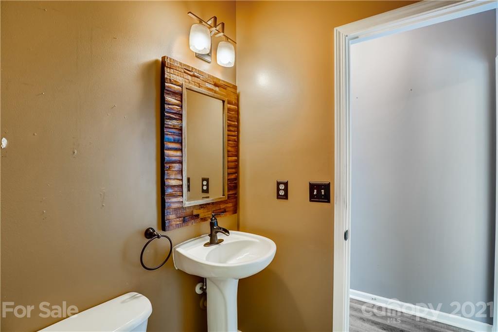 4912 Missi Lane Fort Mill, SC 29708 - Photo 18 of 33 a bathroom with a sink and mirror