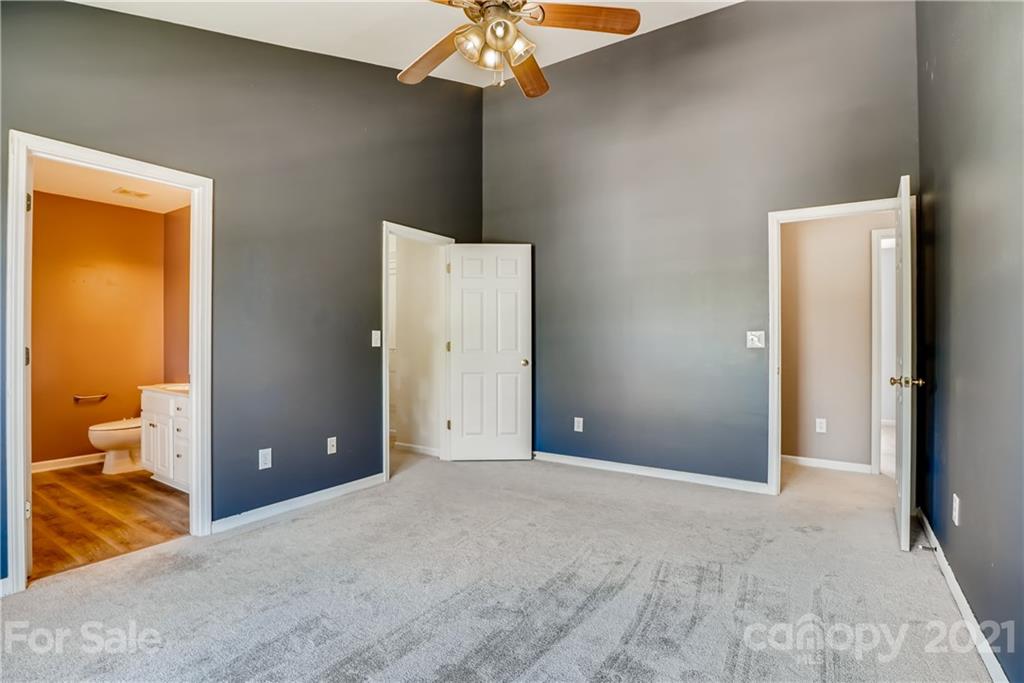 4912 Missi Lane Fort Mill, SC 29708 - Photo 21 of 33 a view of a room with a ceiling fan and bathroom view