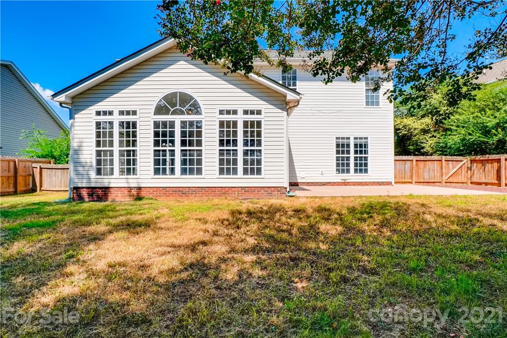 4912 Missi Lane Fort Mill, SC 29708 - Photo 33 of 33 a view of a large white house with a large window and yard